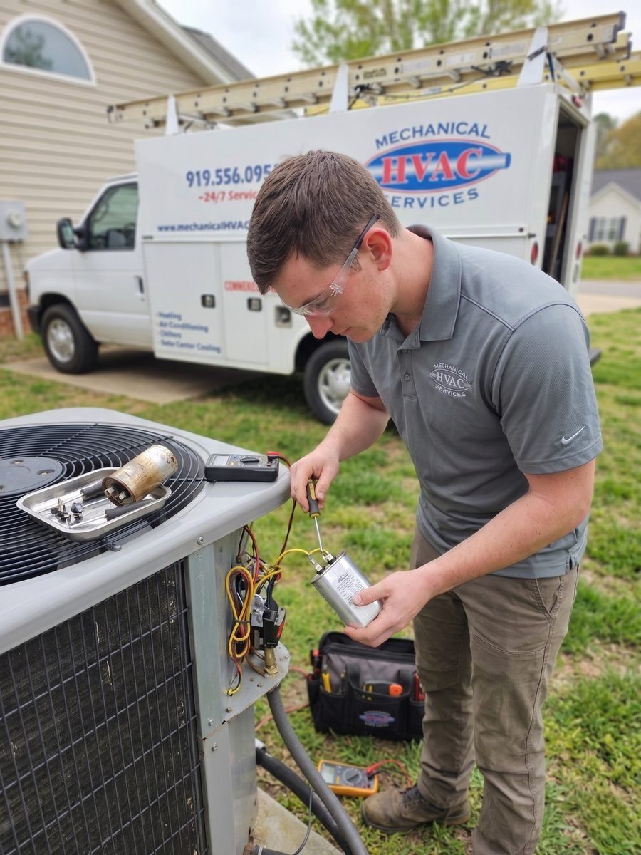 an HVAC technician repairing an outdoor air conditioning condenser unit