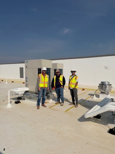 techs with rooftop hvac system