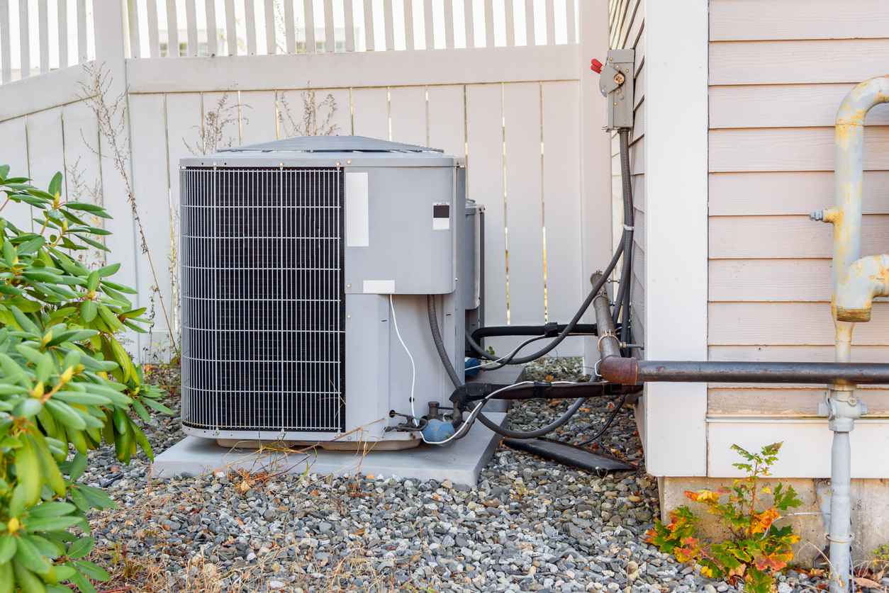 Outdoor air conditioning system on the side of a house